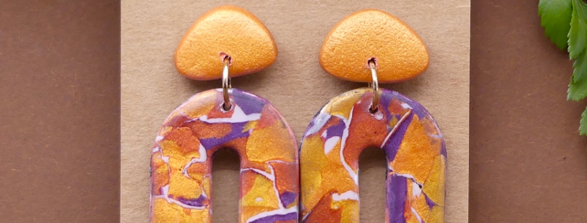 Boucles d'oreilles arcades coloris or, cuivre et violet